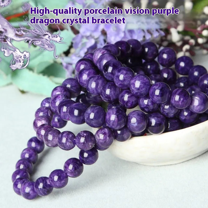 Natural transparent charoite crystal bracelet with platinum settings on wrist.