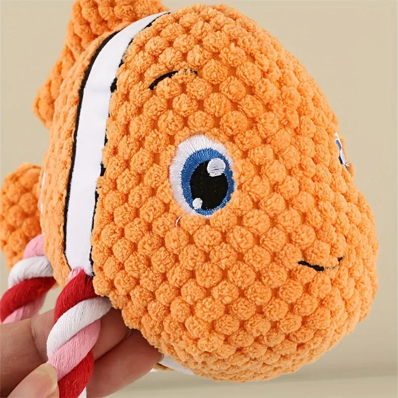 Turtle shaped dog chewing toy in gray green or orange plush fabric with knotted limbs for interactive pet play