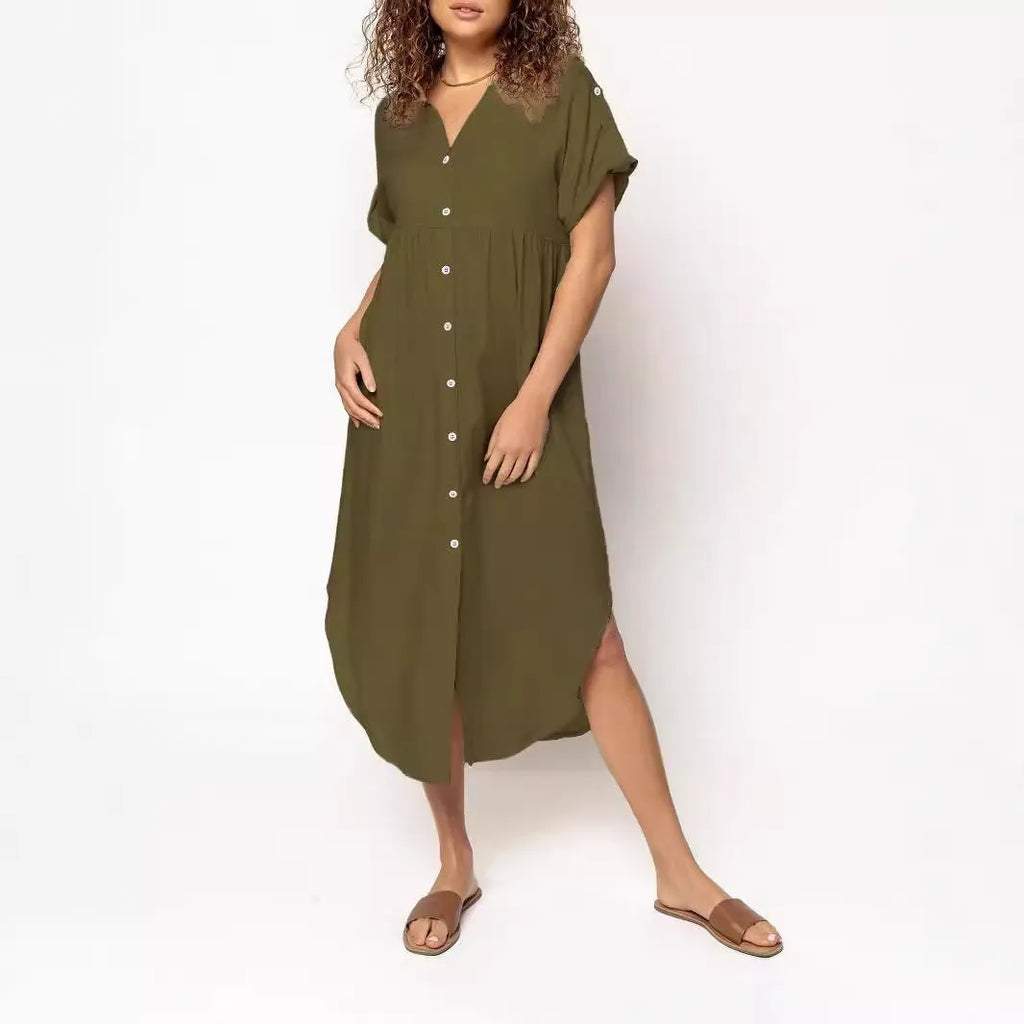 A woman wearing a casual solid-colour mid-length dress with a button-down front.
