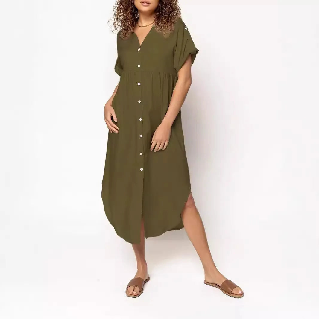 A woman wearing a casual solid-colour mid-length dress with a button-down front.