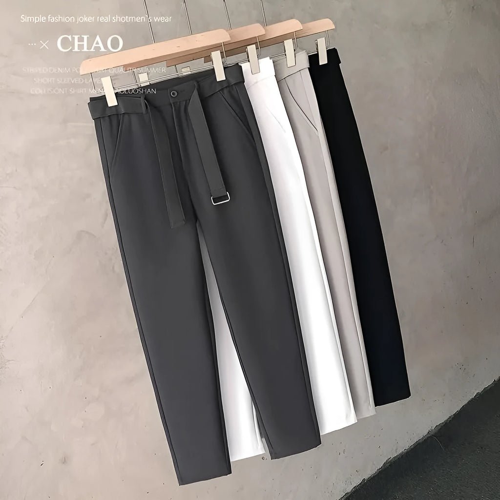 Boys slim straight tapered wool trousers in light grey on a hanger, showing the straight leg opening and business casual style.