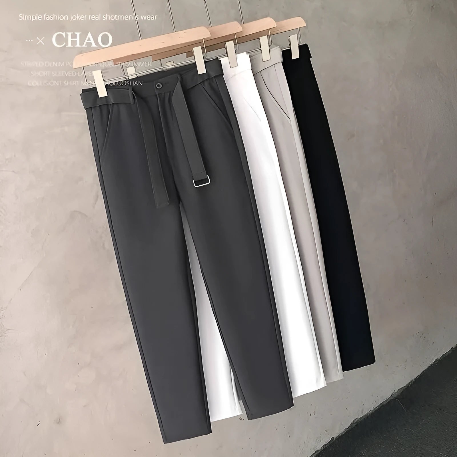 Boys slim straight tapered wool trousers in light grey on a hanger, showing the straight leg opening and business casual style.