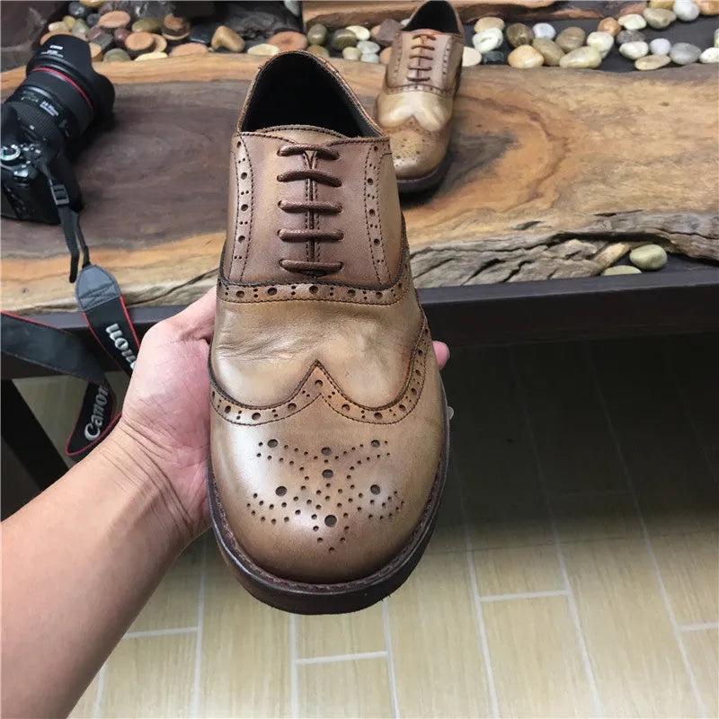 Light brown men's vintage engraved leather casual shoes with distressed finish and lace-up closure.