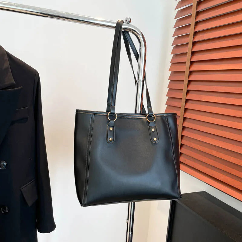 Square black PU underarm shoulder bag with a sandwich pocket design shown from the front.
