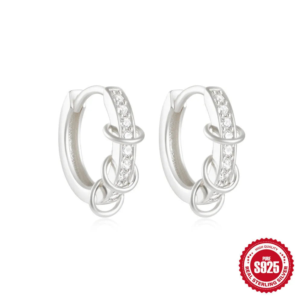 Sterling silver geometric stud earrings with small round design elements in gold or silver finish