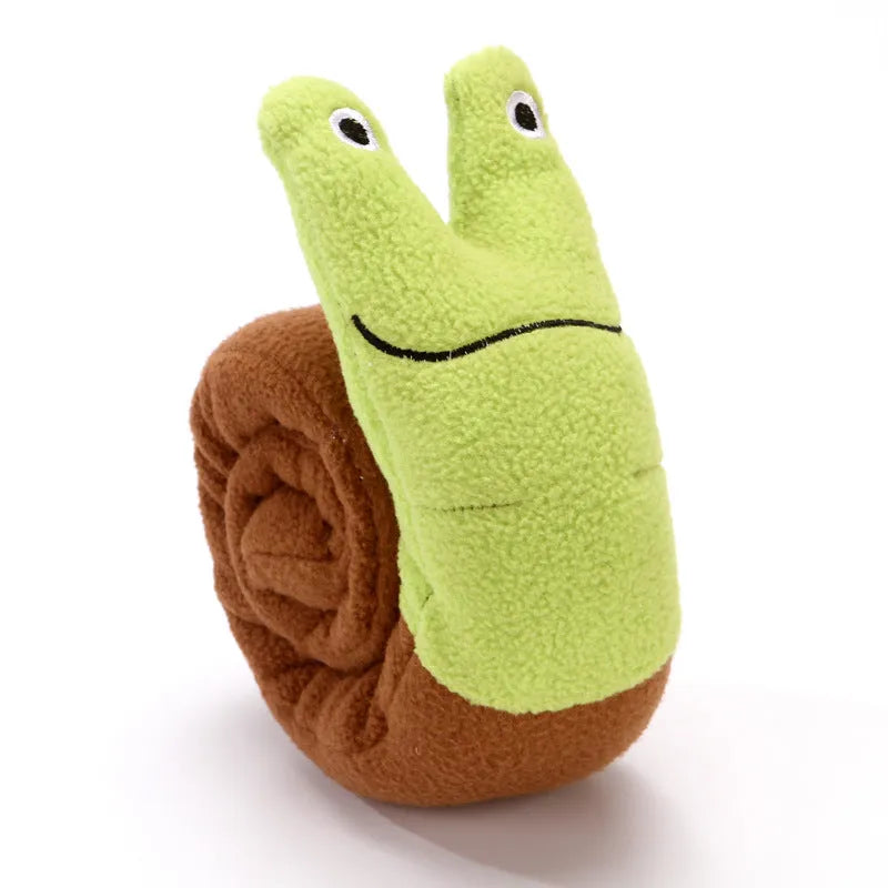 Reversible velvet dog toy shaped like a snail or stick with hidden food holes for foraging training.
