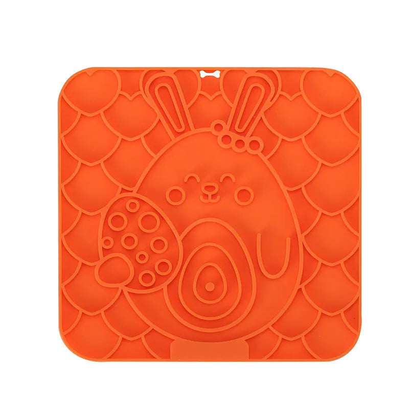 Silicone pet licking mat with suction cup on a tiled floor, featuring a slow food surface for dogs and cats