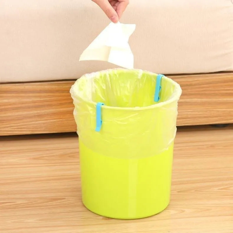White plastic rubbish bag clip with adjustable 16mm jaws for securing bin liners.