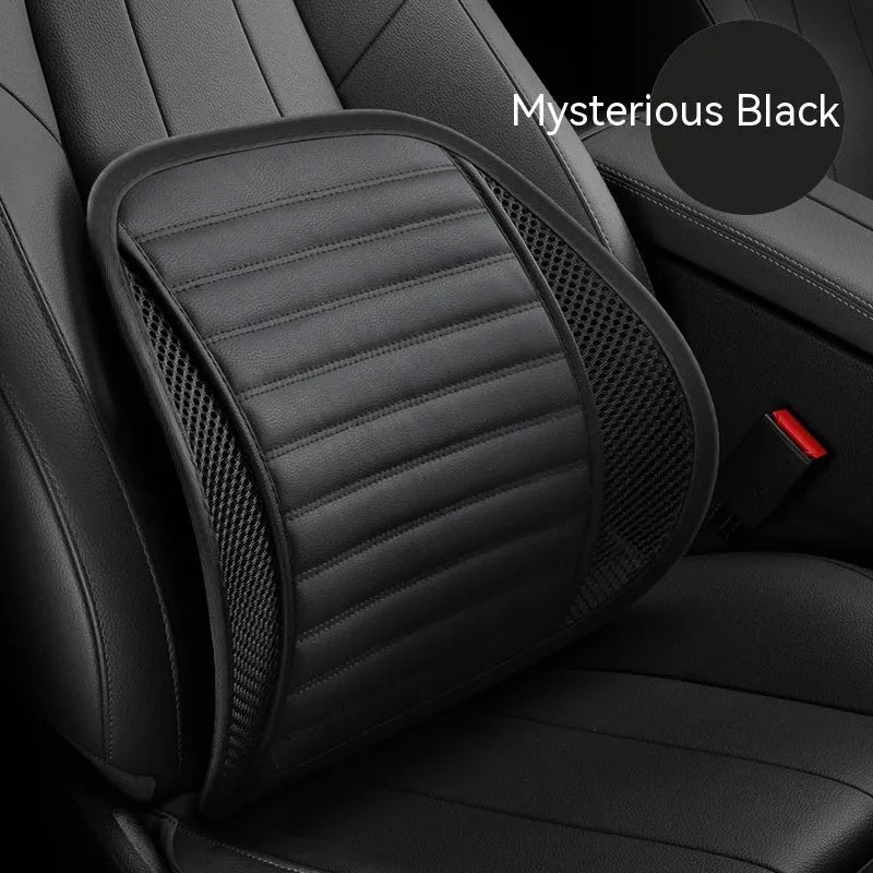 Memory foam lumbar support cushion with PU leather cover in sapphire blue, placed on a car seat.