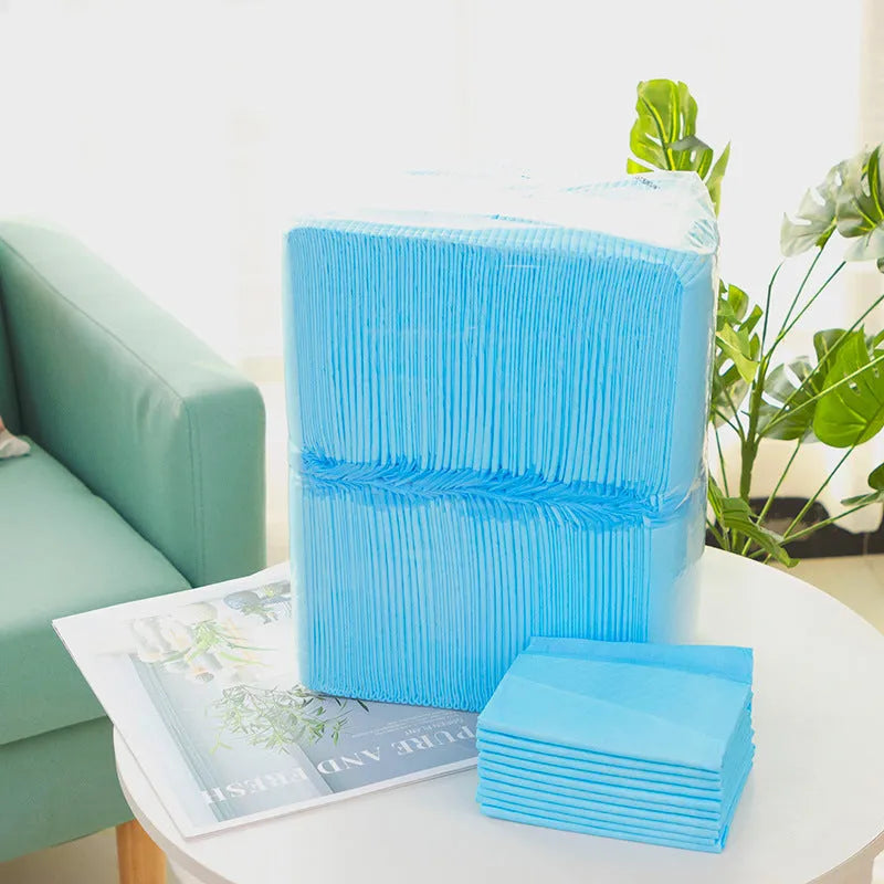 Pack of disposable pet urinal pads showing bamboo charcoal and standard models in S, M, L, XL sizes