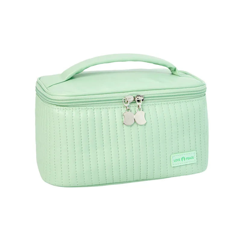 Open-top cake-shaped women's makeup bag in PU leather, shown in a choice of six solid colours.
