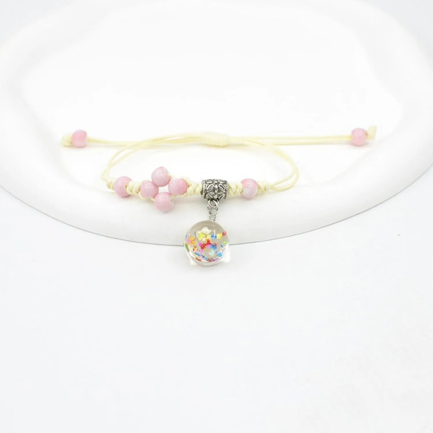 Glass dried flower bracelet with large 1.4cm beads containing real preserved flowers in hand-woven design