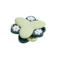 Green and yellow dog puzzle toy slow feeder with 9 compartments and bone-shaped covers