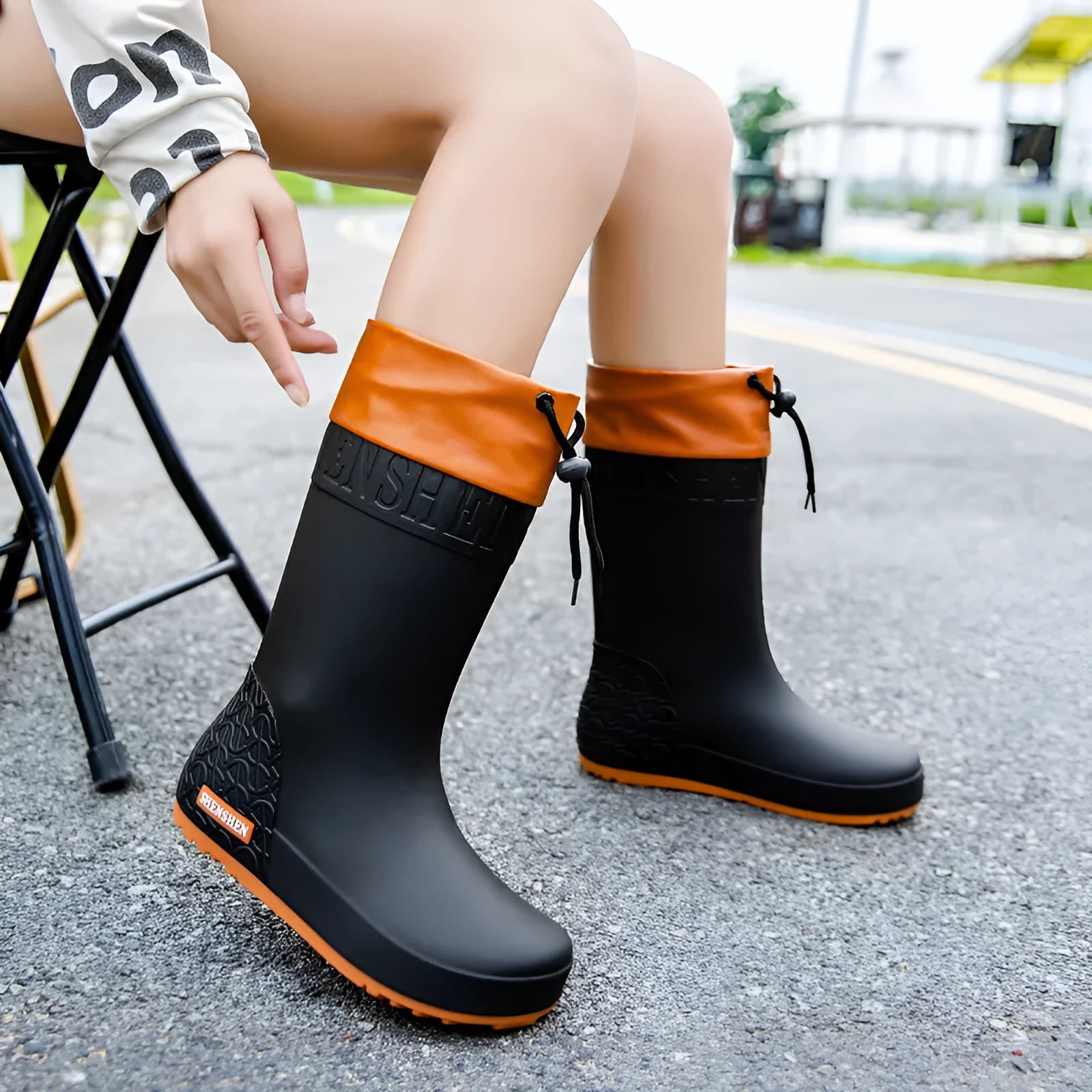 Women's non-slip PVC rain boots in apricot, black, brown and pink colours with wear-resistant soles