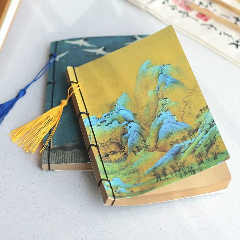 A5 antique wire-bound notebook with retro painting cover, open to show Kraft paper pages