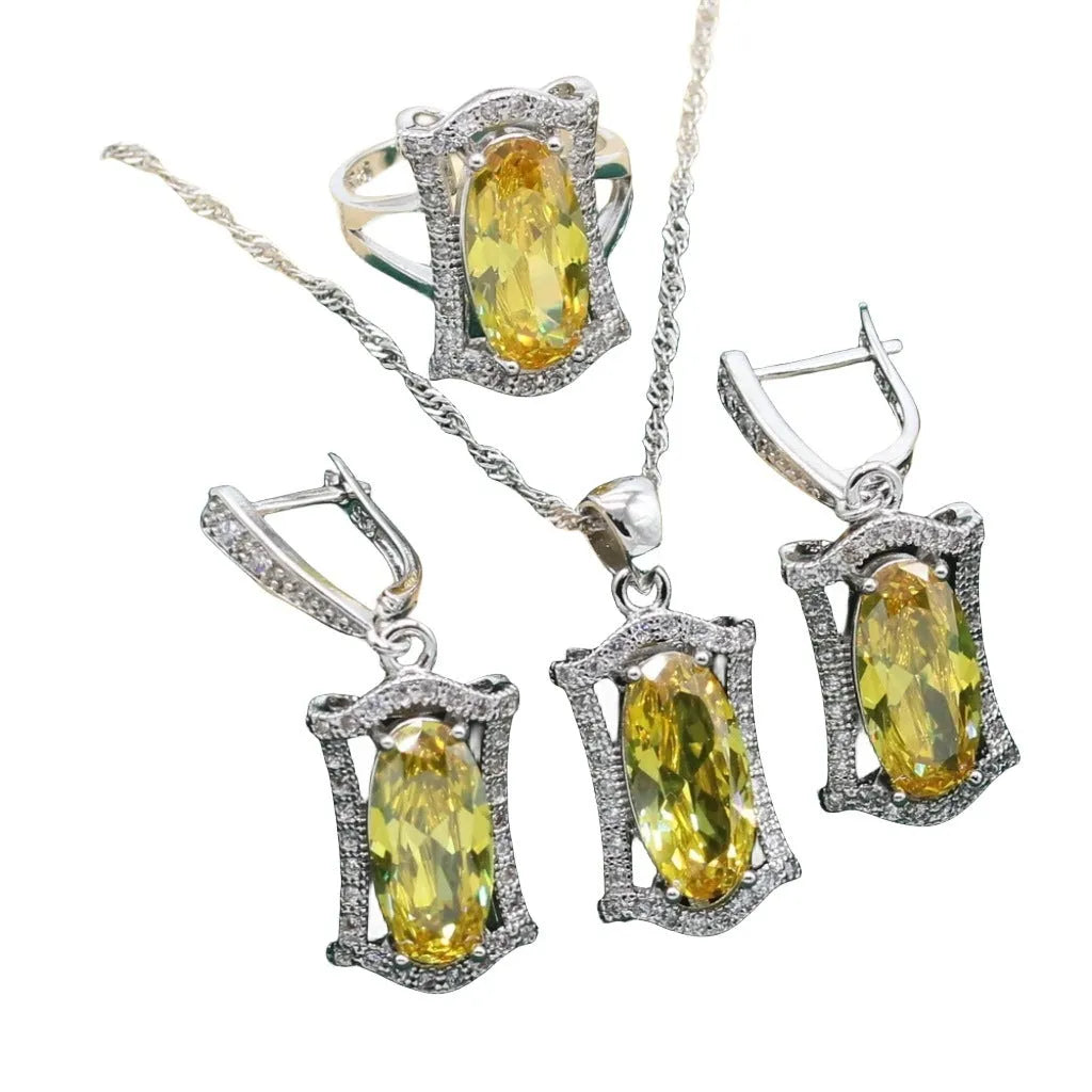 Yellow and olive anti-allergy alloy zircon jewellery set showing necklace, earrings, ring, and bracelet on a dark background.