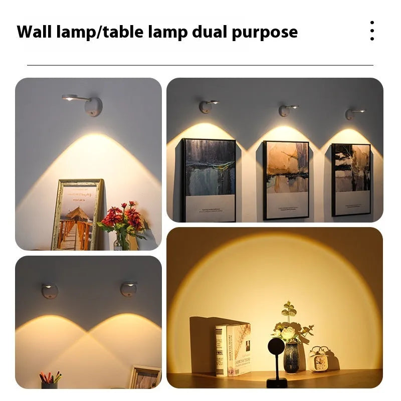 Modern geometric rechargeable wireless wall spotlight lamp in black on a white wall.