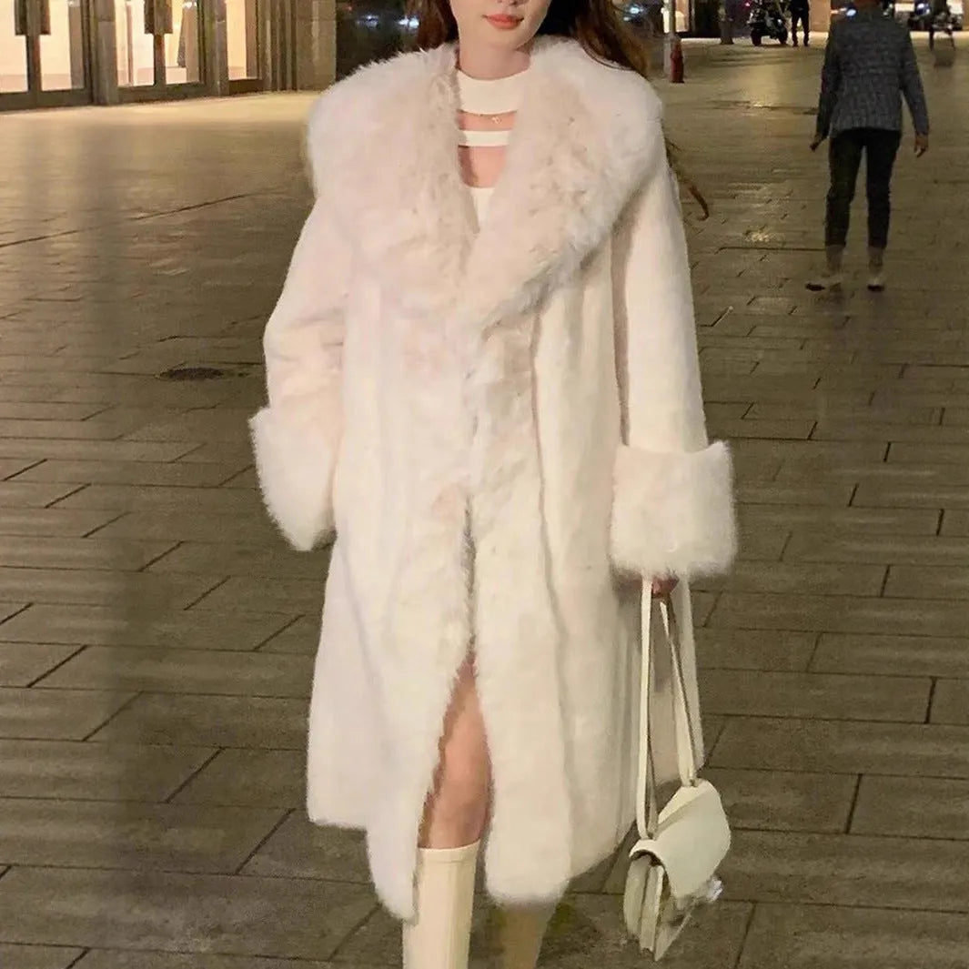 Grey women's mid-length coat with faux fur body, leather detailing, and a matching artificial fur collar.