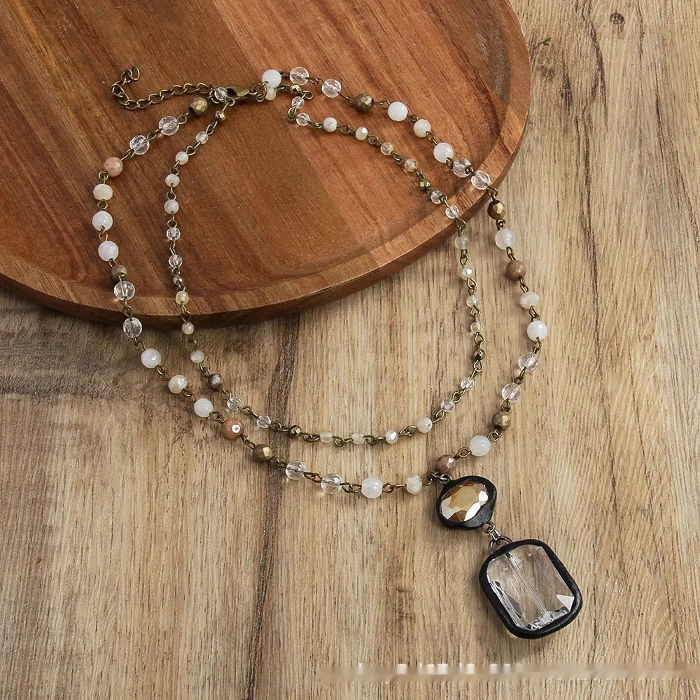 Two-layer tribal necklace with glass and natural stone pendant on adjustable alloy chain in beige colour