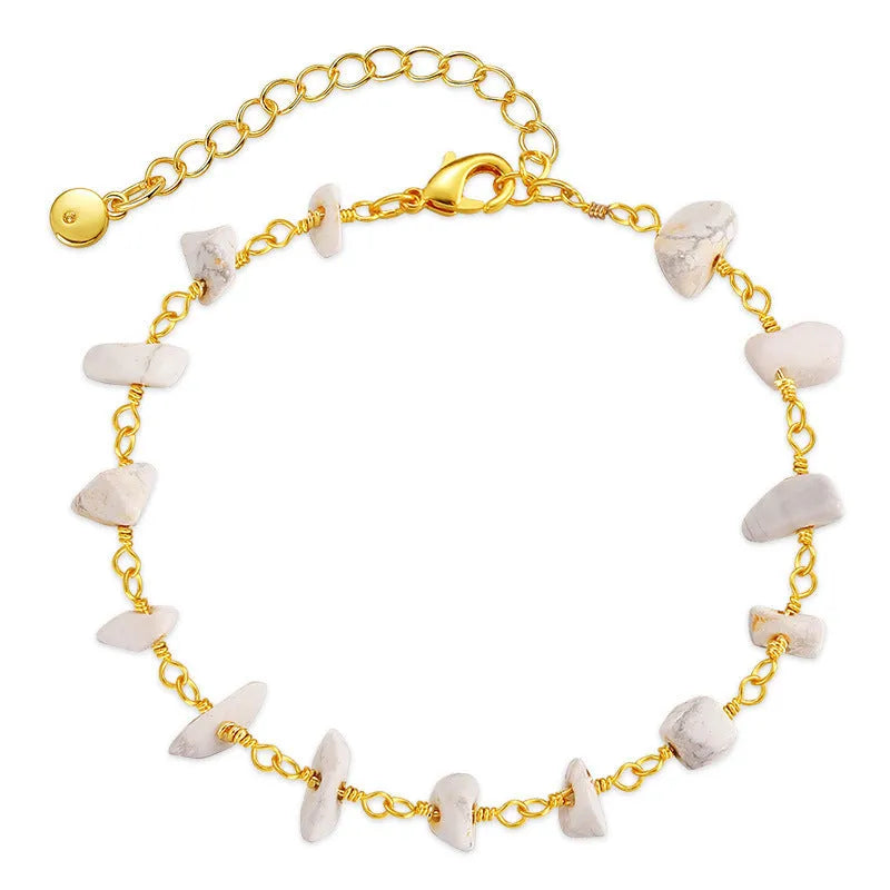 Geometric women's bracelet with natural gravel turquoise stones and crystal accents on gold plated copper.