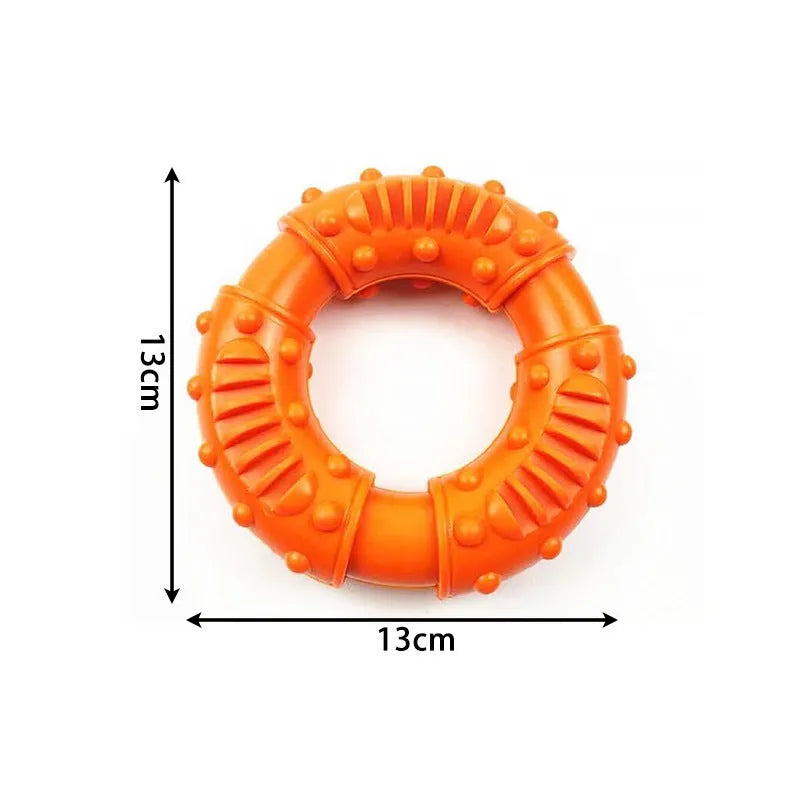 Blue hollow dog fetch stick toy on grass, showing lightweight, chewable design for outdoor play.