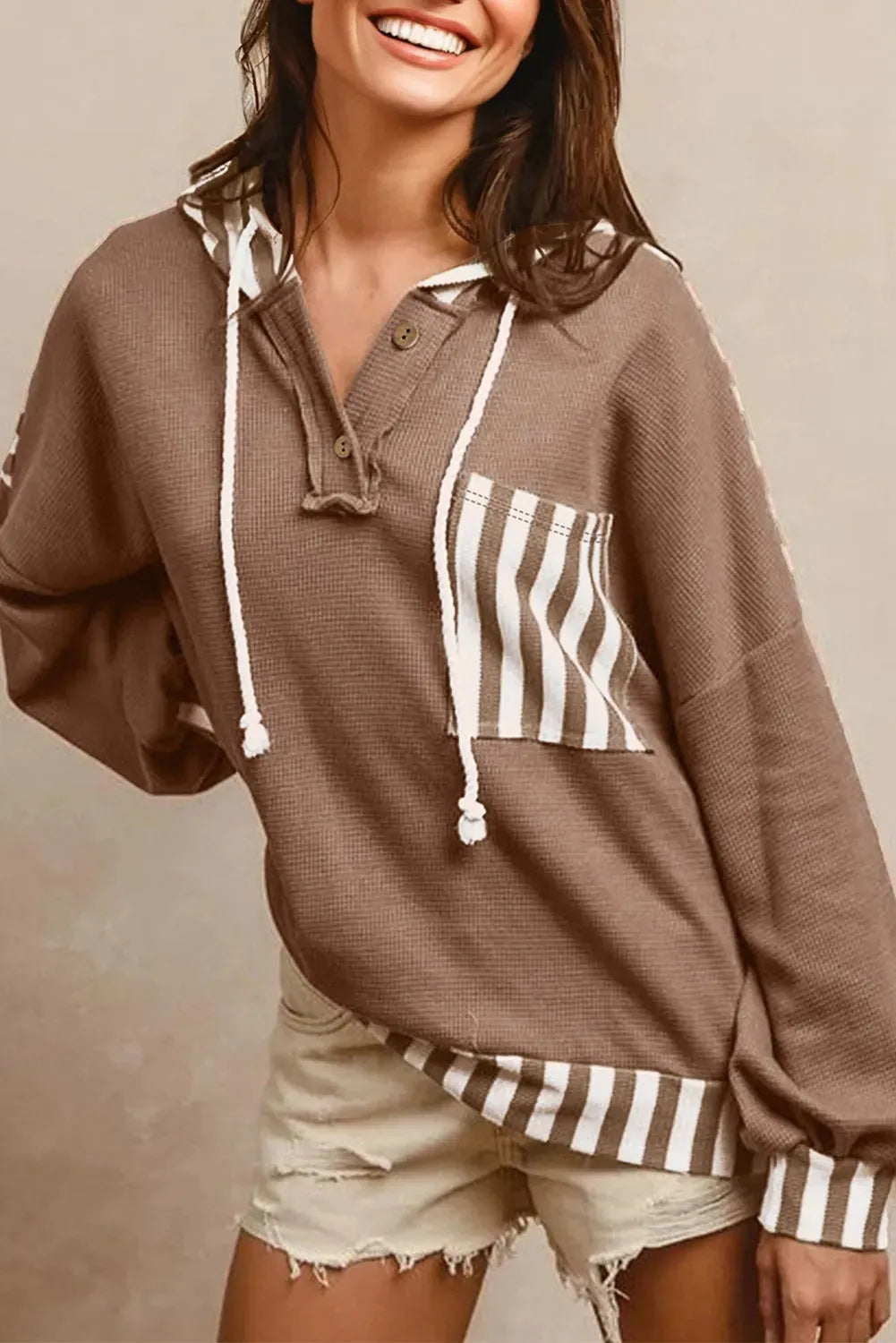 Straw yellow striped patchwork hoodie with button neck and drawstring hood in waffle texture fabric