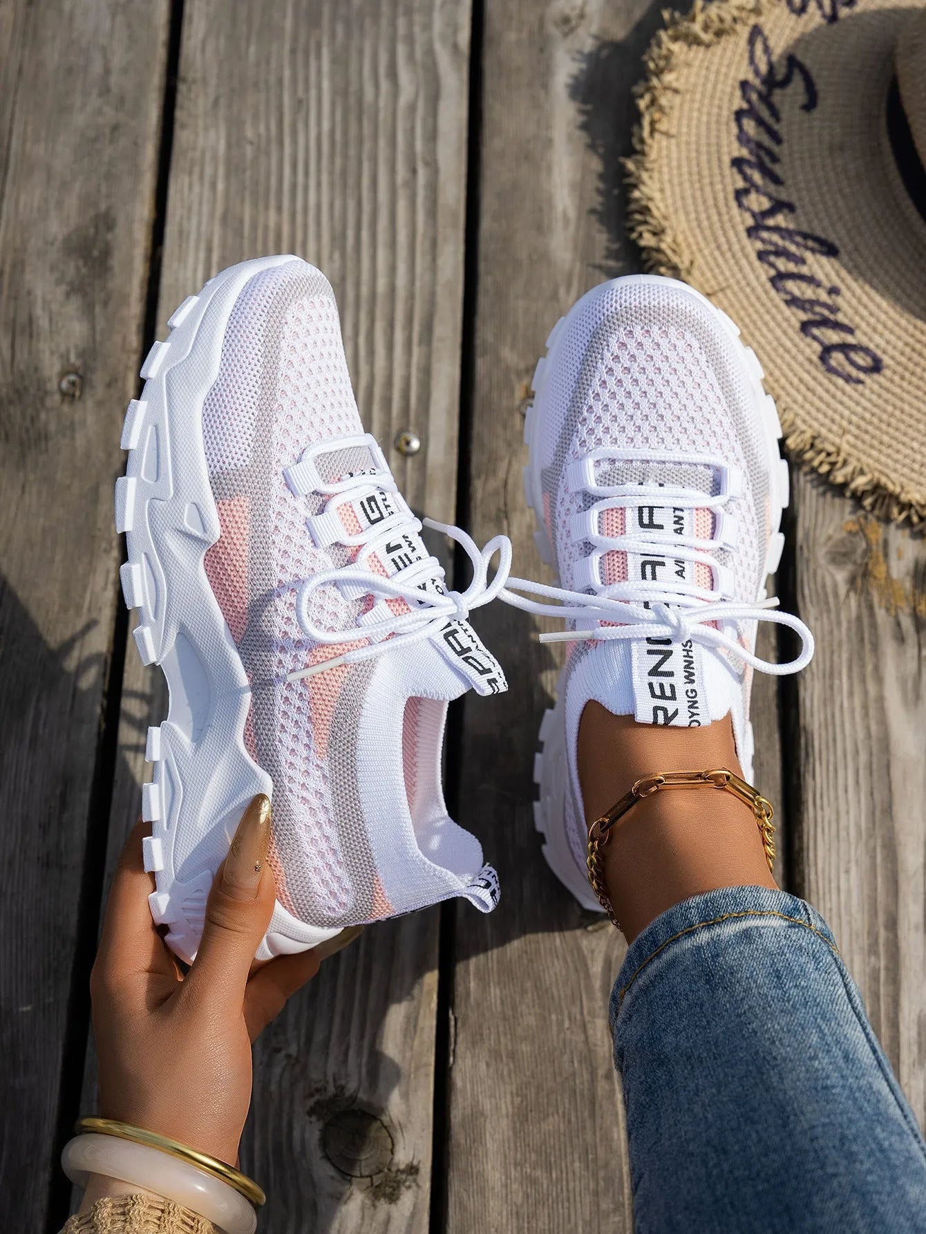 Women's Flyknit mesh lace-up sneakers in grey and white colourway