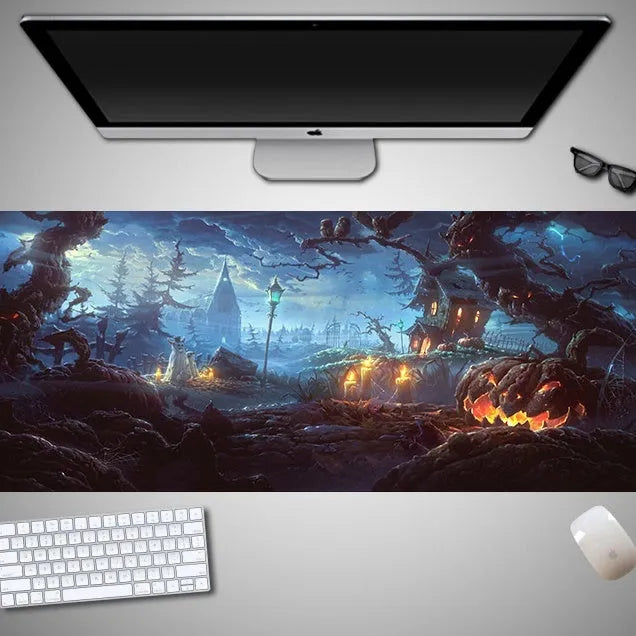 Large Halloween-themed computer mouse pad with graphic design on a desk
