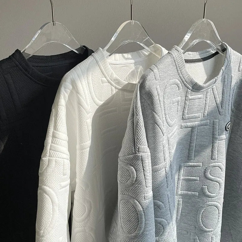 Men's grey short sleeve t-shirt with a raised white 3D letter pattern on the chest