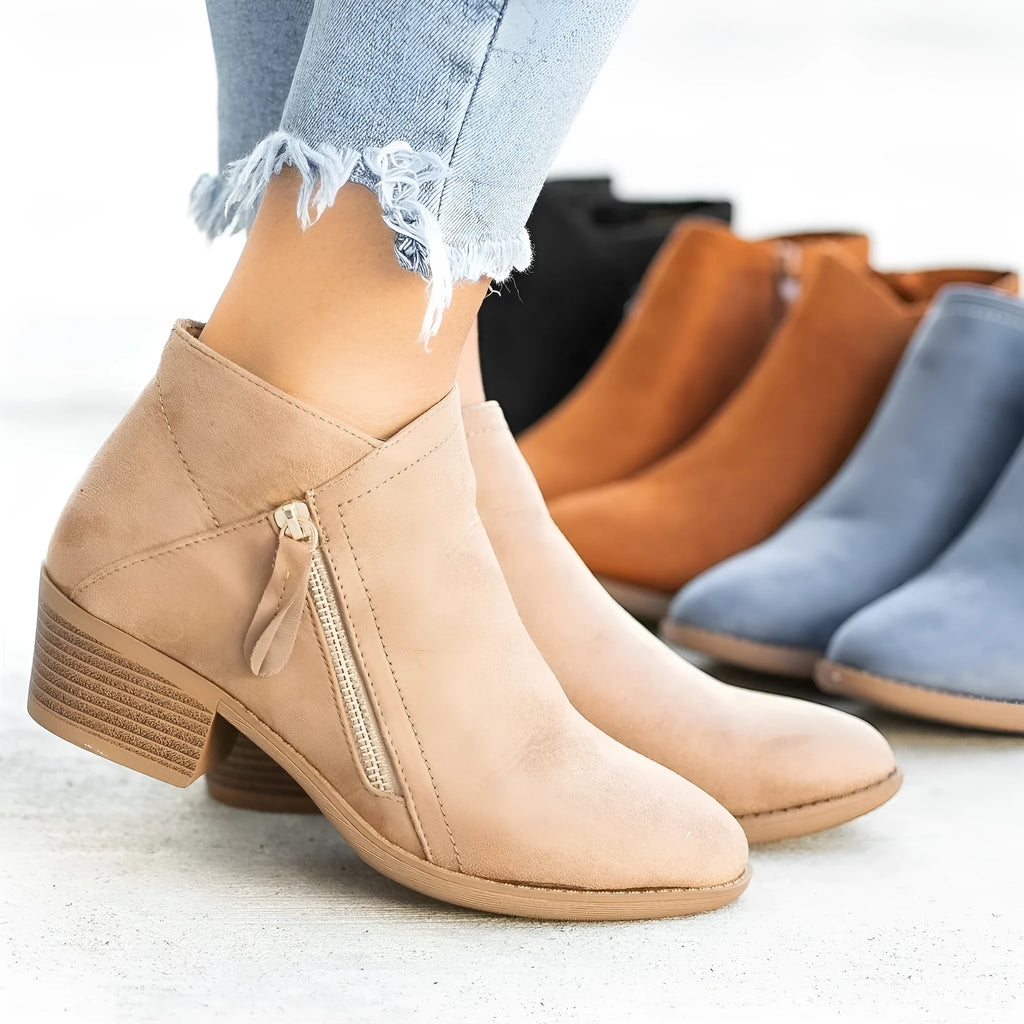 Women's suede ankle boots with side zip and chunky heel in beige, black, blue, or orange.