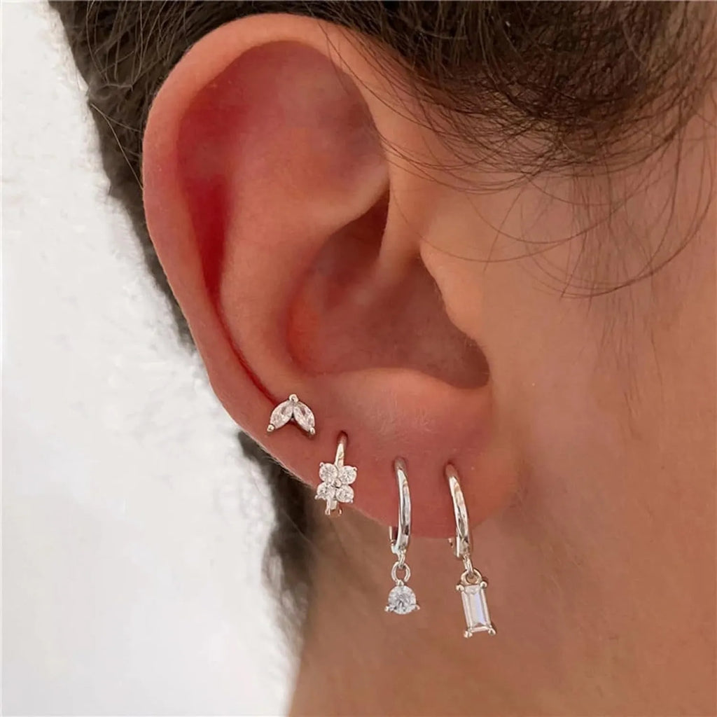 Copper geometric square earrings with electroplated gold or silver finishes showing star and geometric shapes