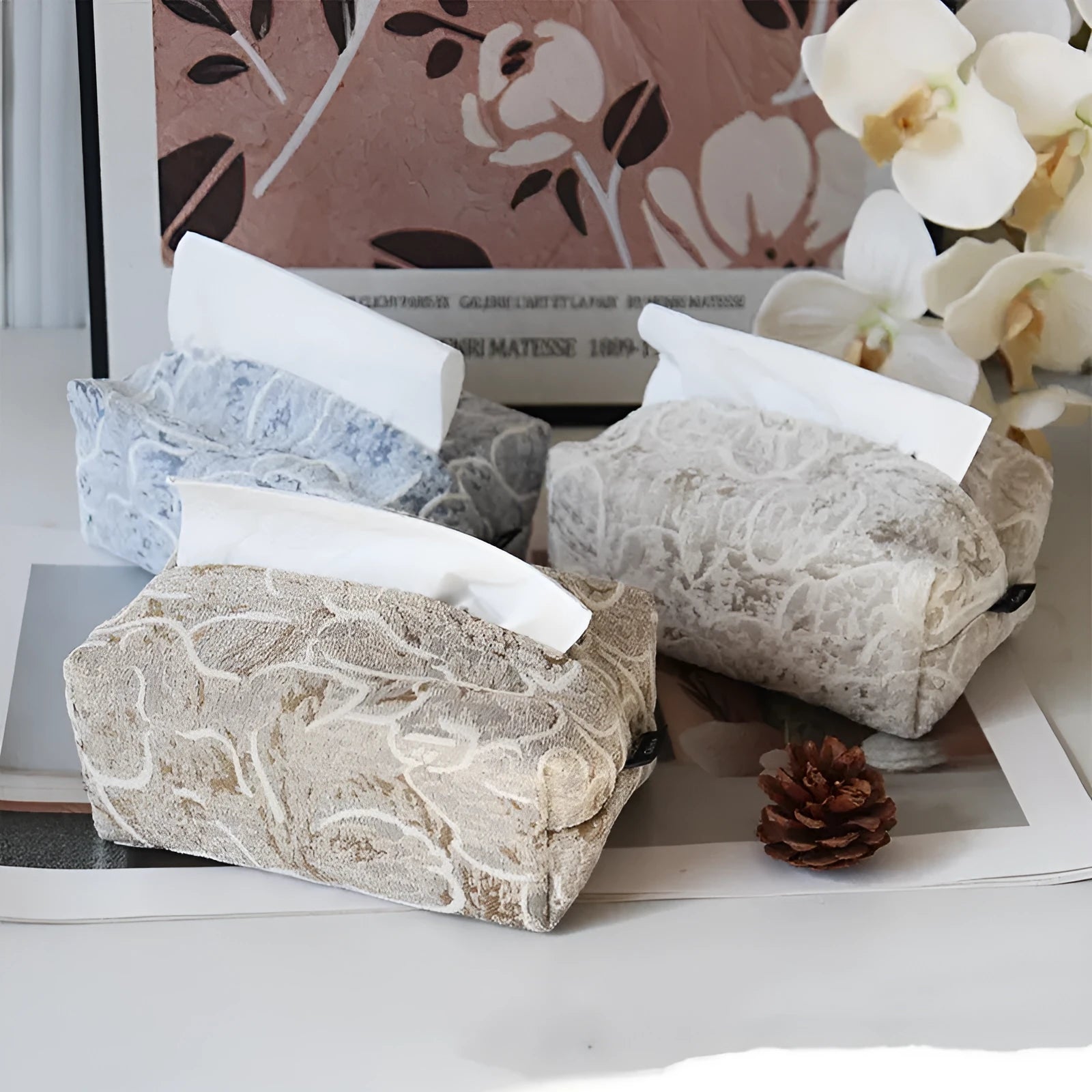 Cotton floral tissue box in beige, blue, or brown on a wooden table.