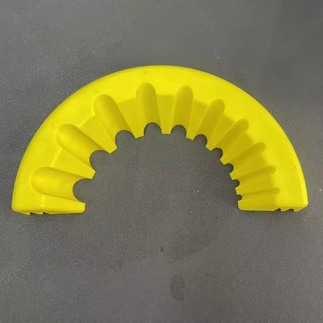 Yellow, green, and black plastic angle grinder bracket holder for sealant cartridges.
