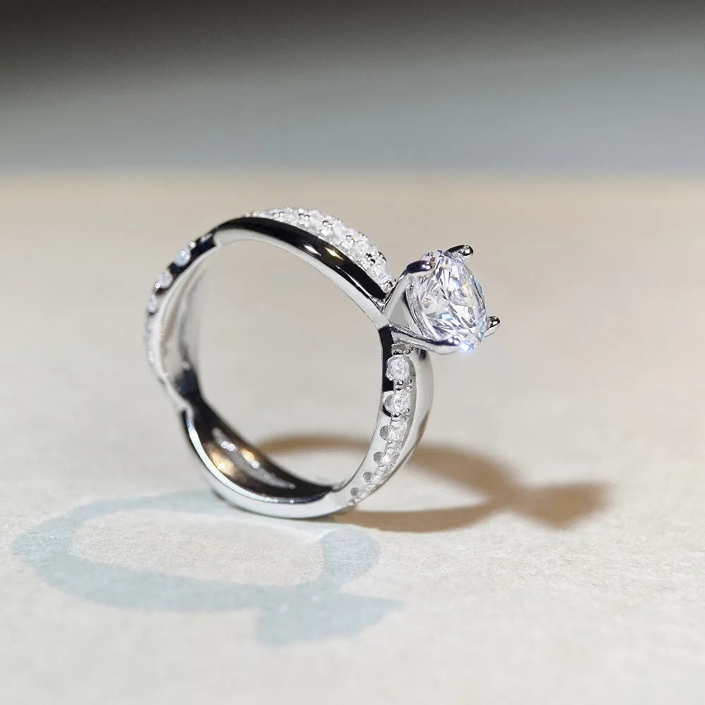 Silver geometric cross ring with 1 karat moissanite stone and twisted band