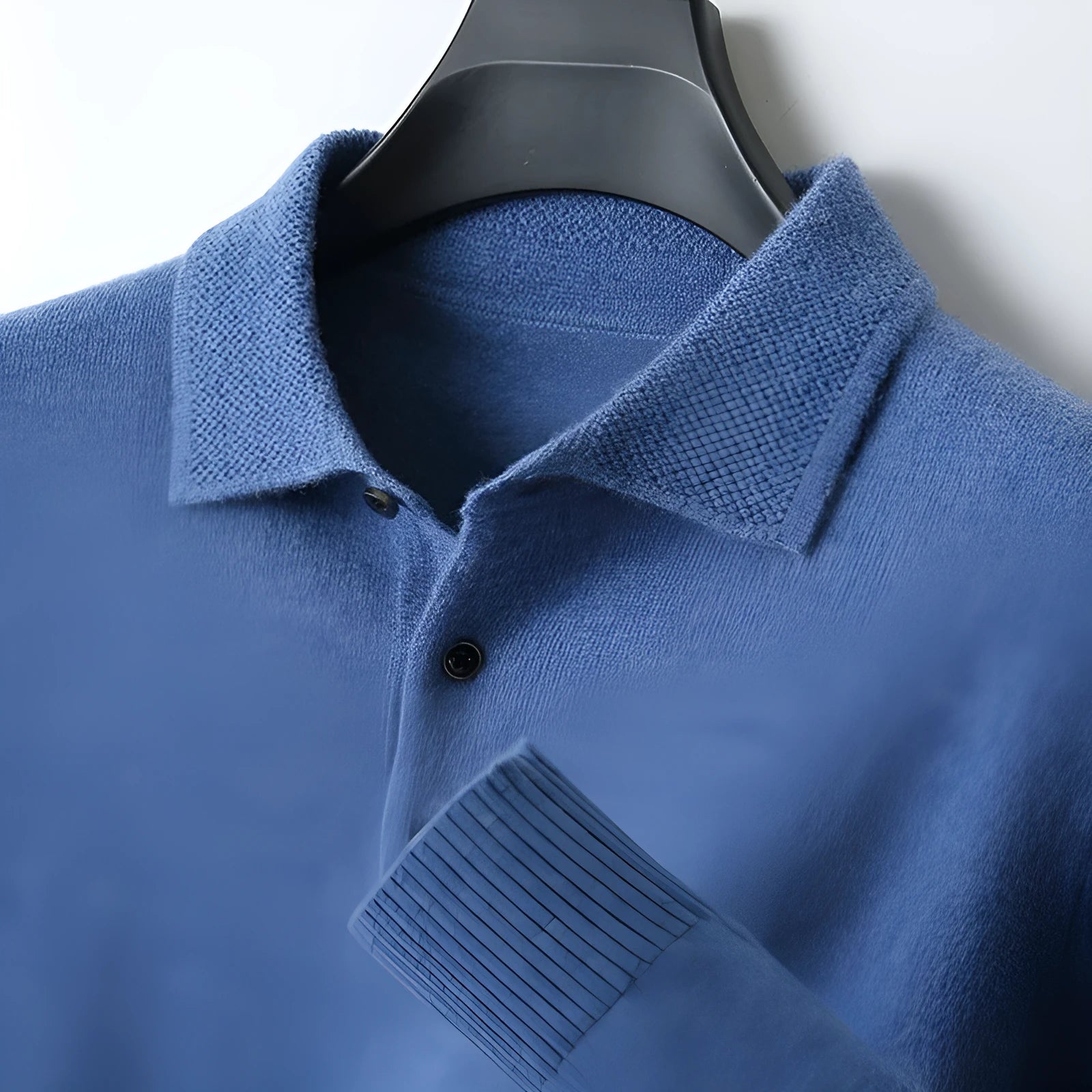 Men's grey wool pullover sweater with a polo collar and long sleeves, showing textured collage stitching.