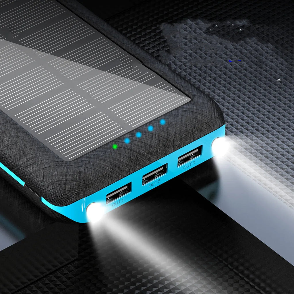 Black wireless solar power bank with Qi charging pad, three USB ports and an LED flashlight