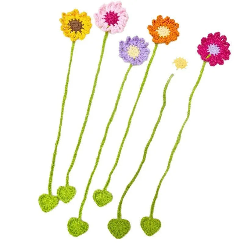 Hand-crocheted daisy flexible wire bookmark in yellow, pink, light purple, and orange colours.