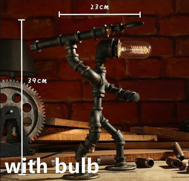 Green bronze vintage robot table lamp with industrial iron pipe design on wooden desk