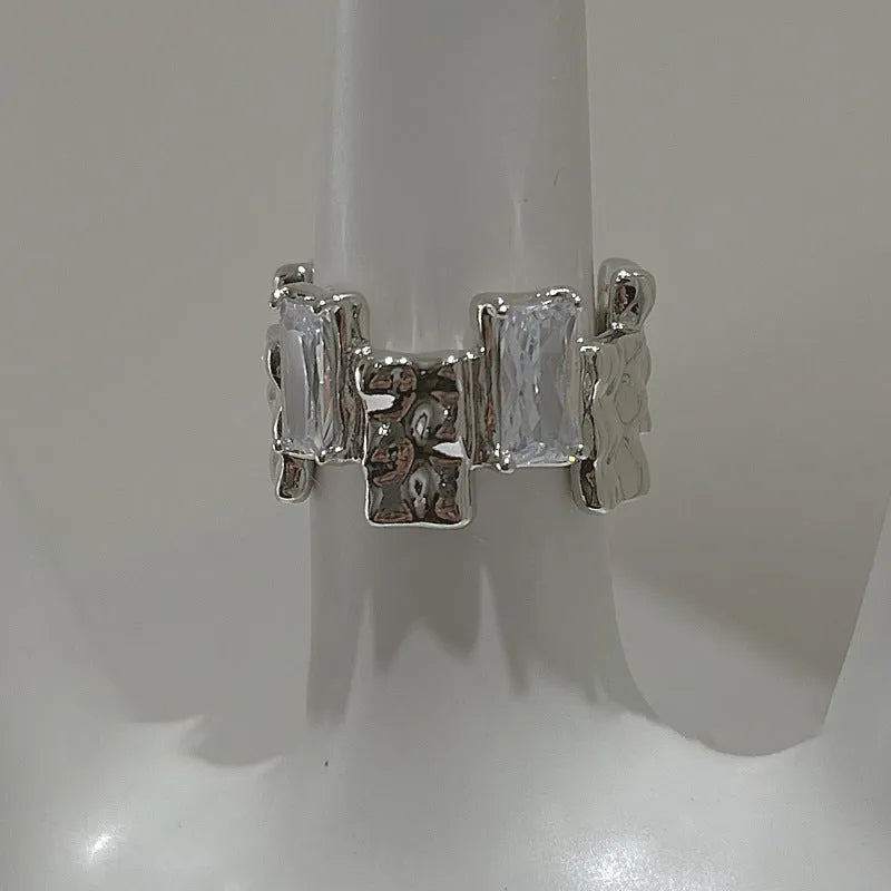 Silver cross zircon ring with open geometric design and three-dimensional decoration