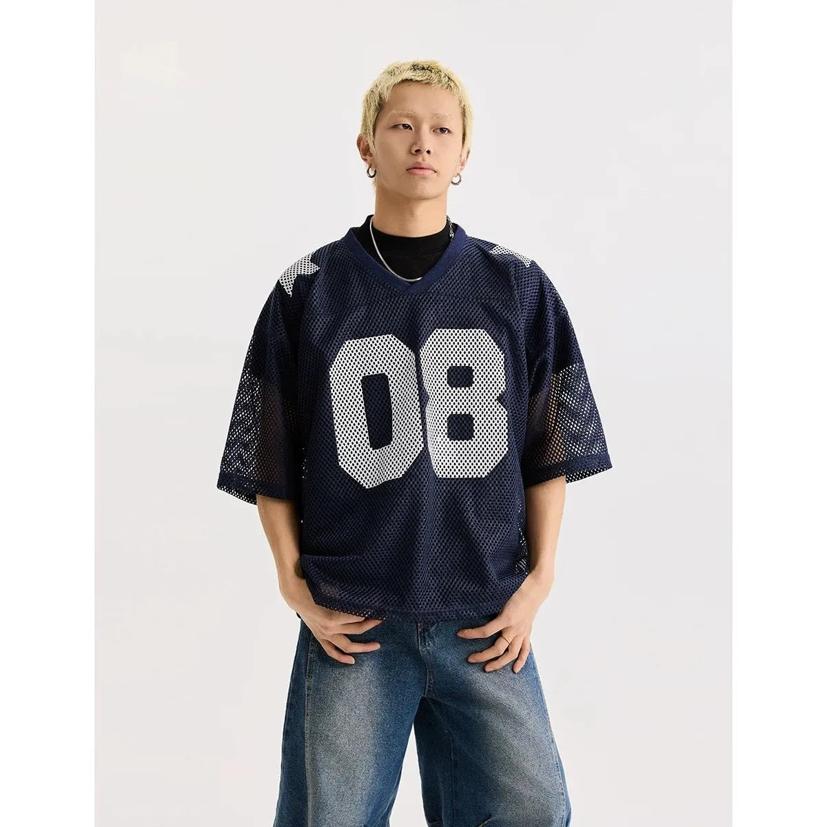 Black loose-fit short sleeve shirt with white letter print pattern, modelled flat