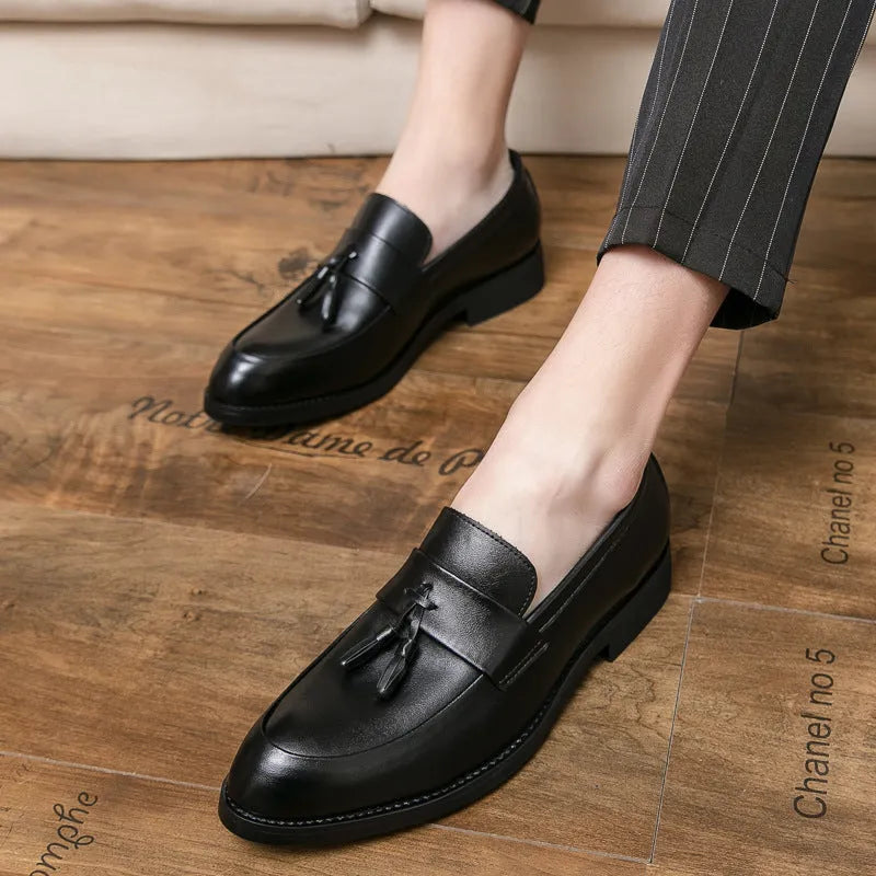 Men's black and brown business casual slip-on shoes with tassel detail and rubber soles