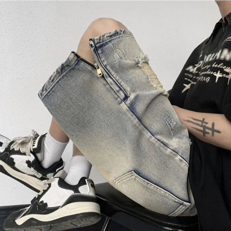 Blue retro-style denim shorts with a wide-leg loose fit and tattered details on a neutral background.