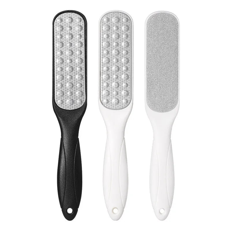 Stainless steel foot grinder with double-sided black and white sandpaper surfaces for callus removal
