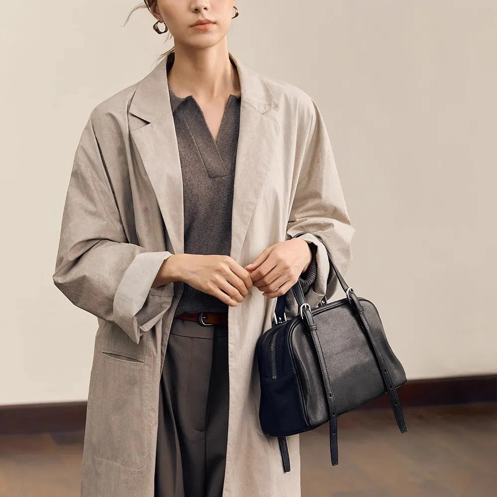 Women's genuine leather retro shoulder bag showing horizontal square design with double straps in black colour option.
