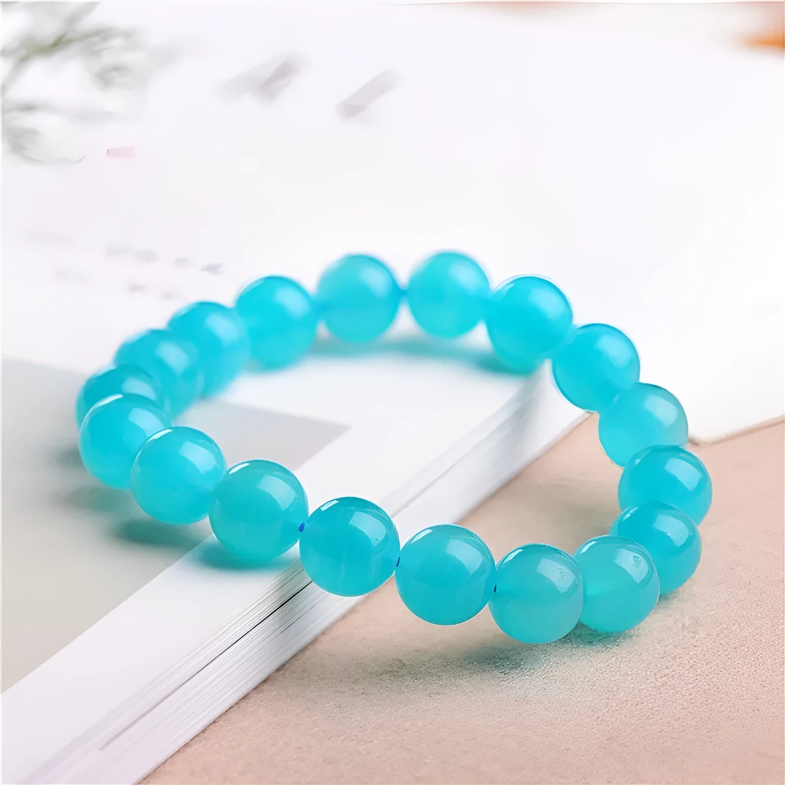 Amazonite natural scattered beads in ice colour showing polished surface and hole drilling