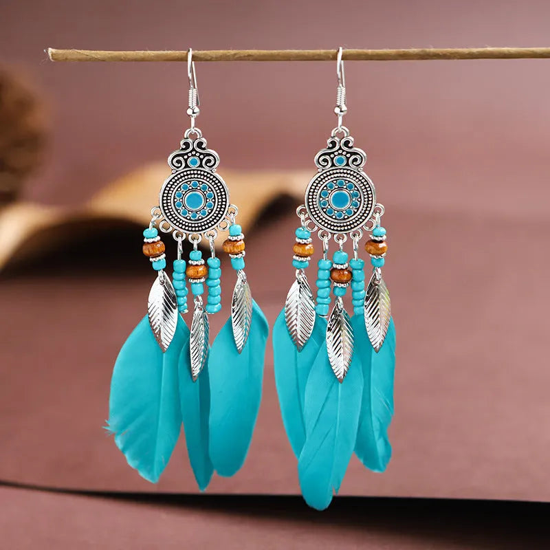 Round drop feather earrings with leaf detailing in various bohemian colours