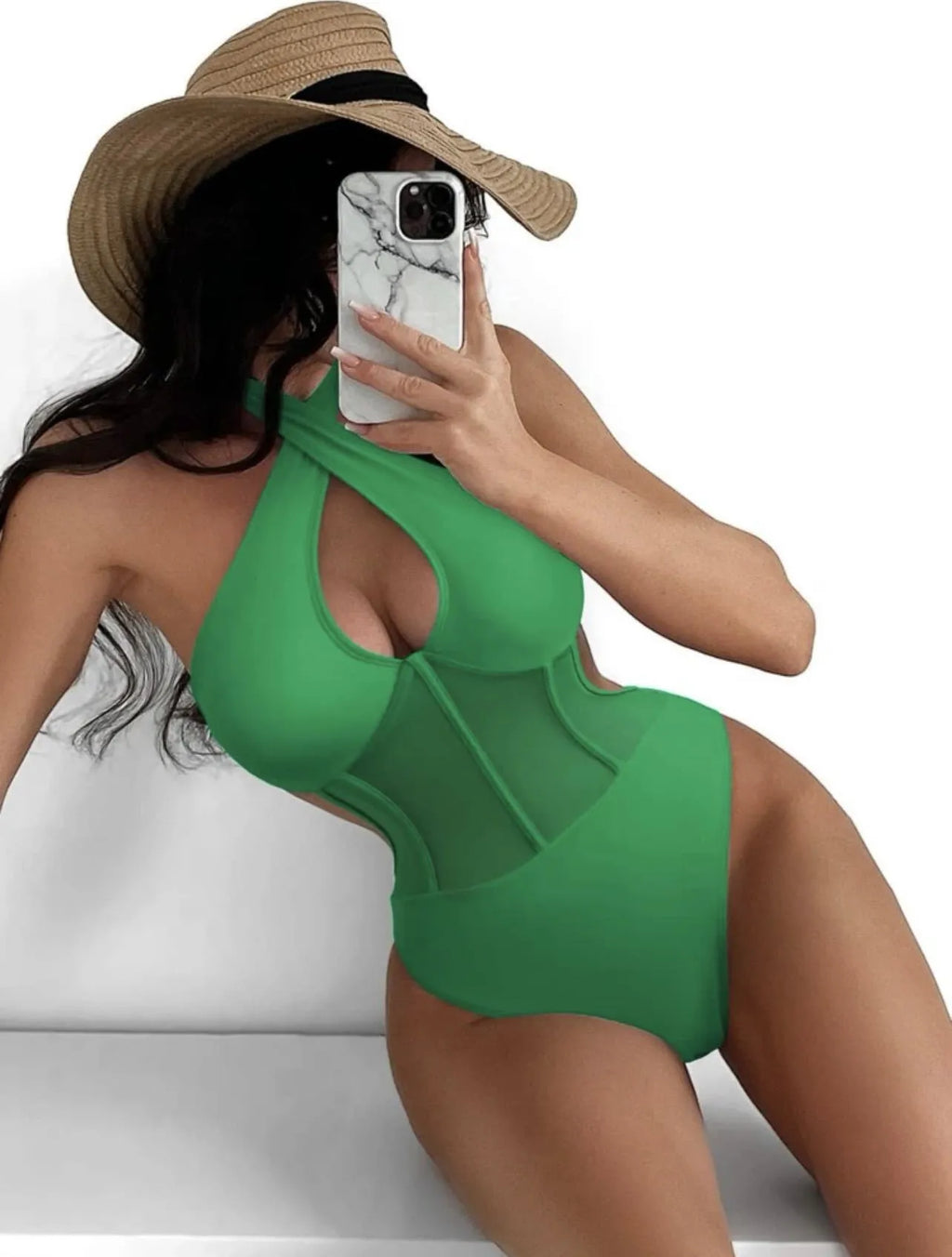 A woman's one-piece swimsuit bikini in a nylon and spandex blend, shown in black, rose red, and green colour options.