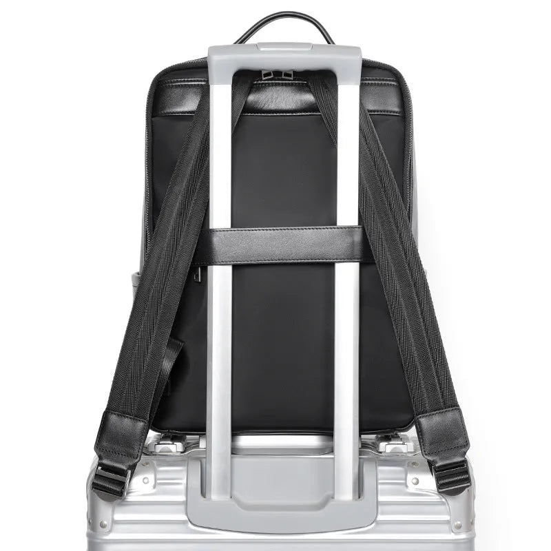 Black genuine leather men's business laptop backpack with 36-55L capacity showing weaving design details
