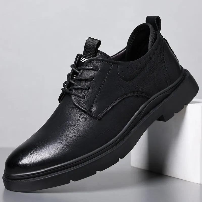 Men's black and brown leather casual sneakers with rubber soles and sewn detailing