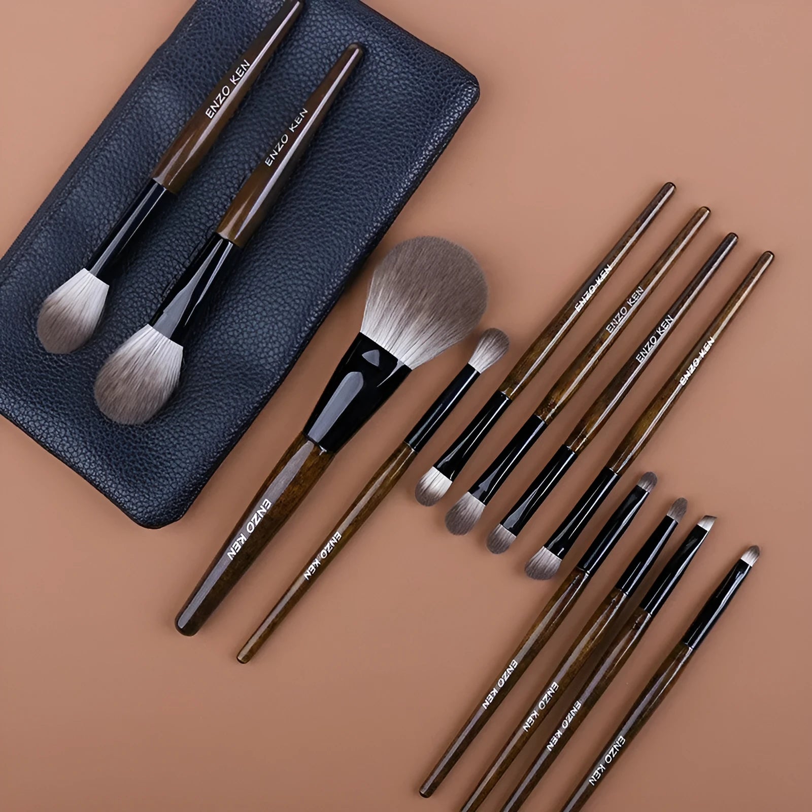 12-piece makeup brush set with wooden handles and a grey PU travel bag